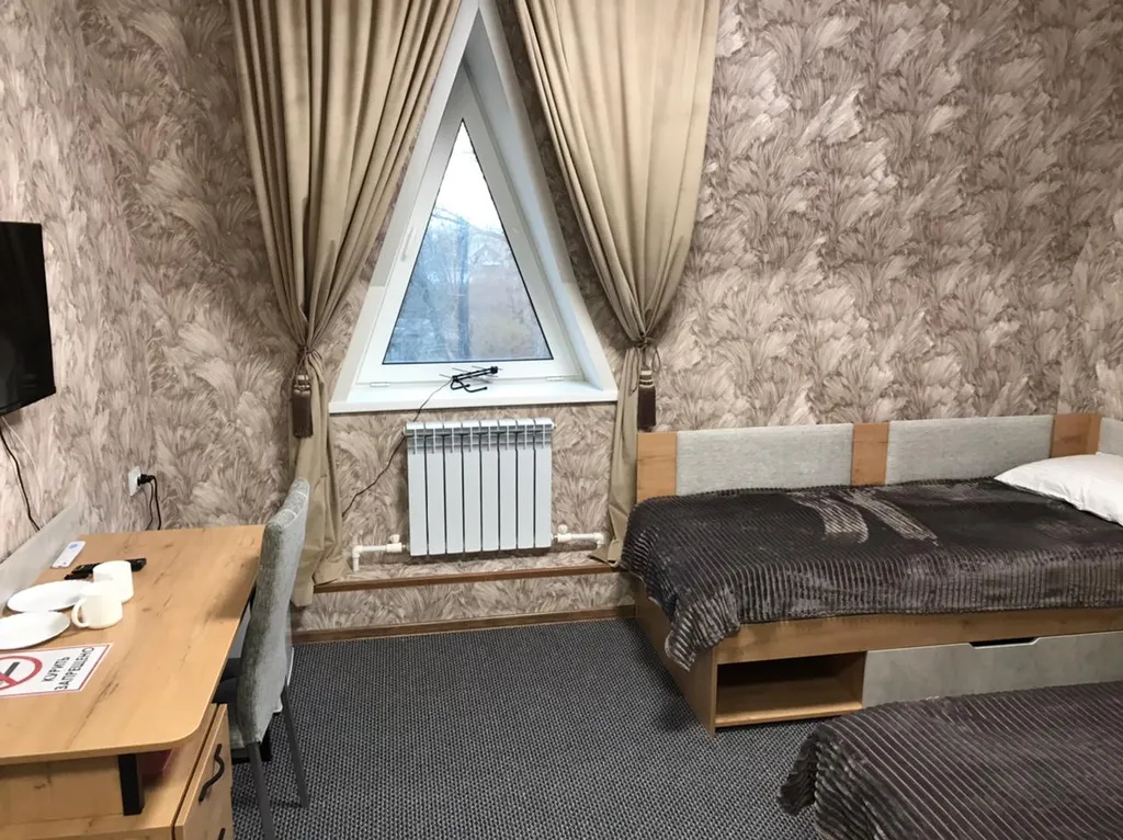 Двухместный номер с 2 отдельными кроватями улучшенный с видом на город — общий вид