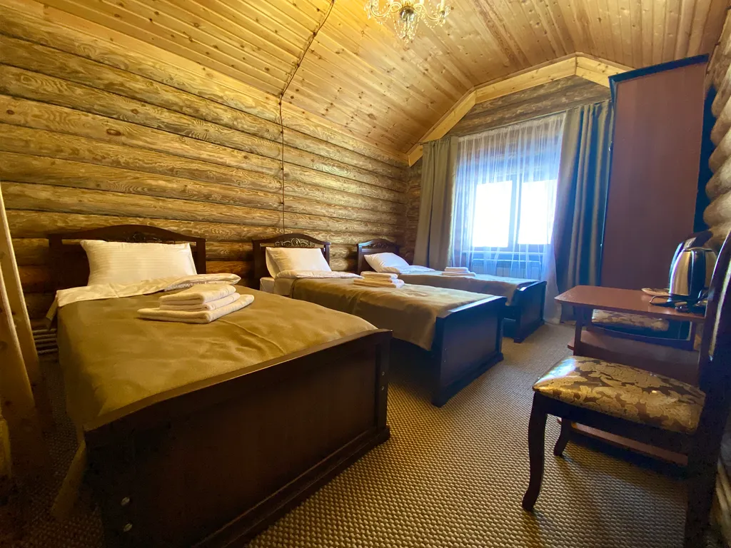 Дом с тремя 1-но спальными кроватями и футоном