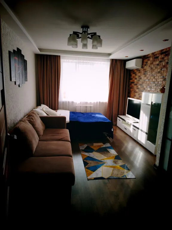 Квартира однокомнатная на улице Радужной, 45 м², Чебоксары — спальня, фото 2