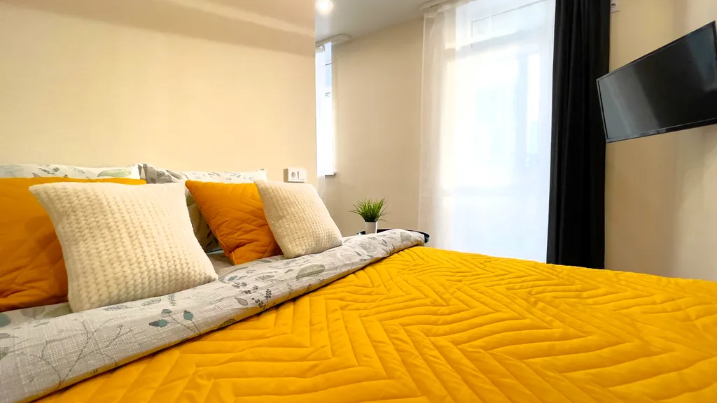 Квартира однокомнатная на улице Пархоменко, 28 м², Тюмень — спальня, фото 2