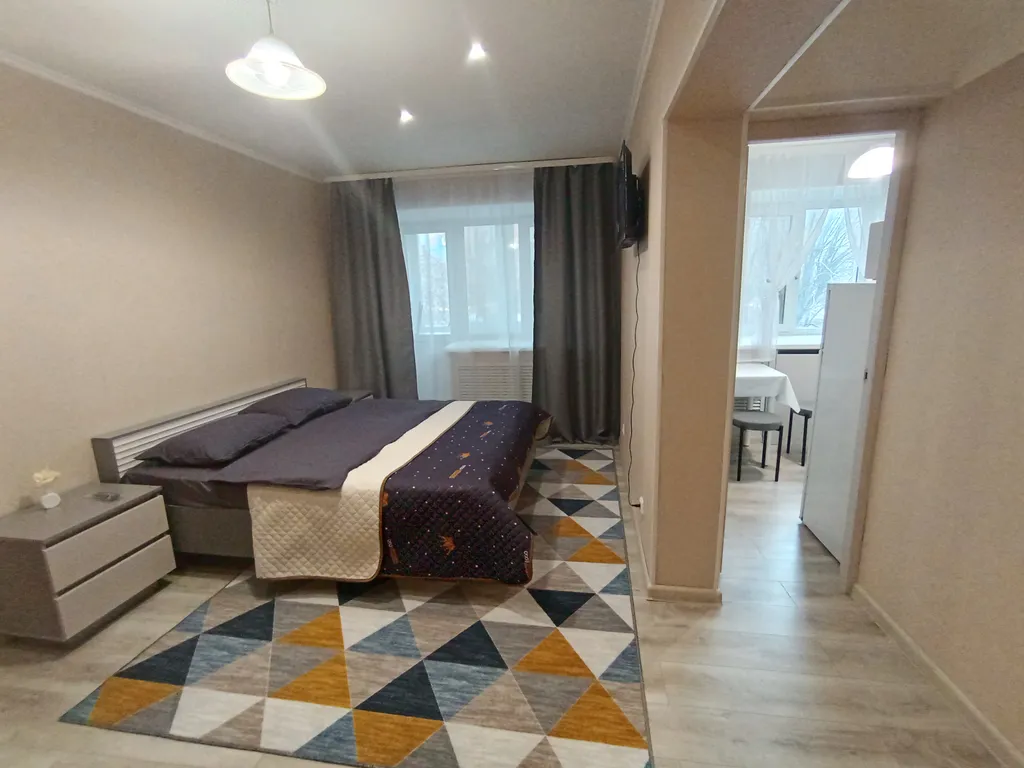 Квартира однокомнатная на улице Рижской, 30 м², Тюмень — спальня, фото 4